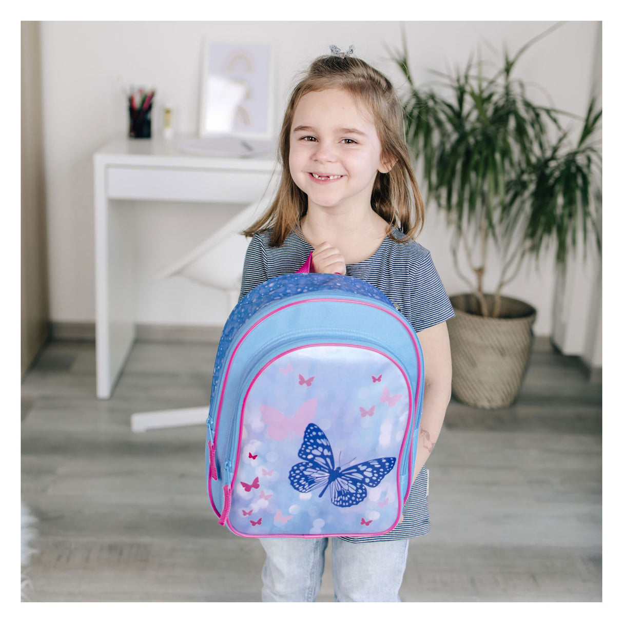 Undercover backpack with front pocket butterflies