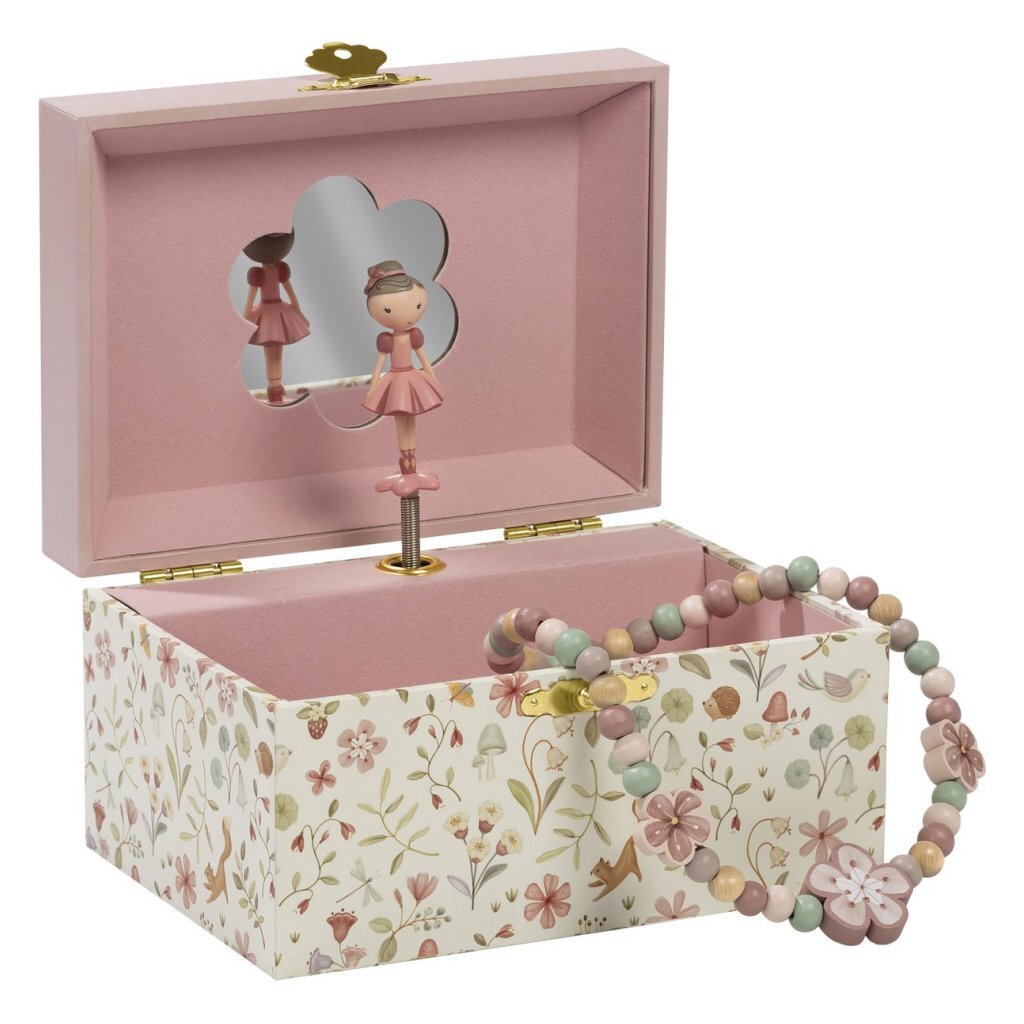 Bambolino bawi się małą holenderską szkatułką na biżuterię z muzyką
