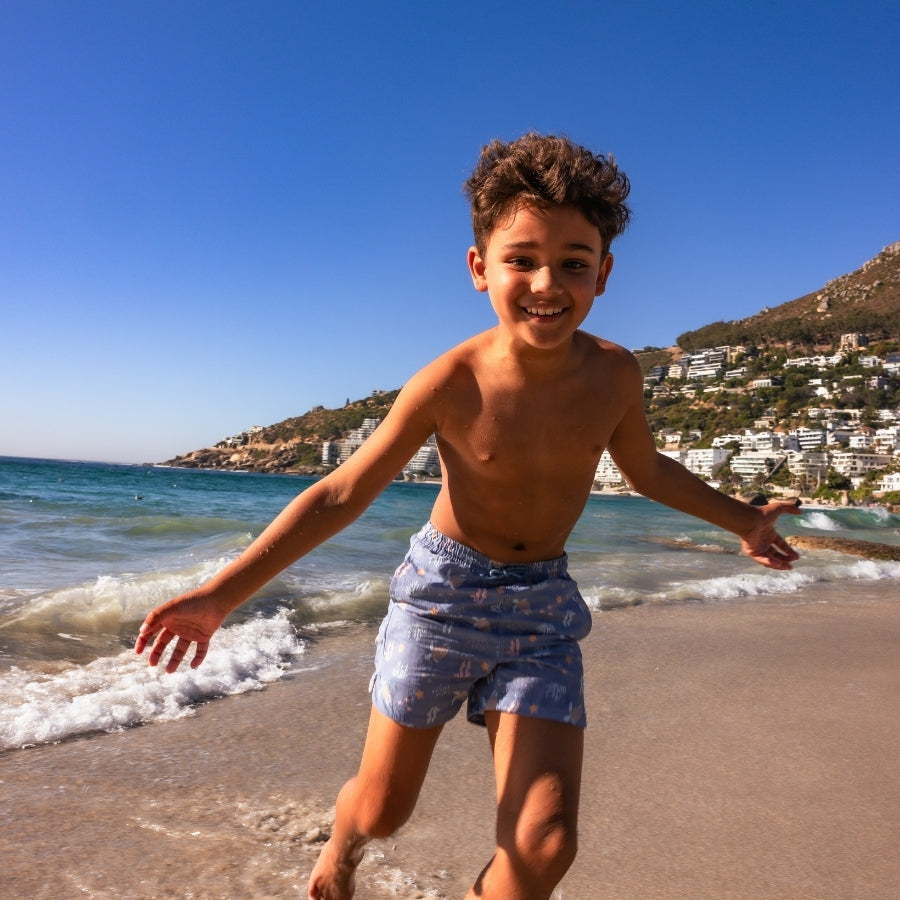 Coral bliss | multi-colored UV swim trunks for boys