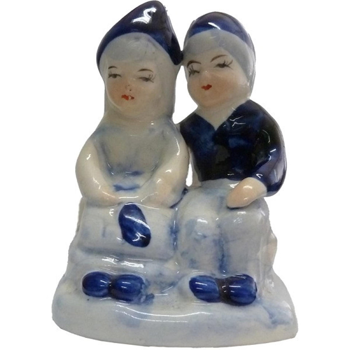 Delft blue earthenware couple sitting