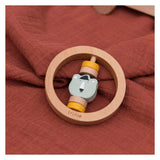 Trixie wooden rattle around Mr. Bear