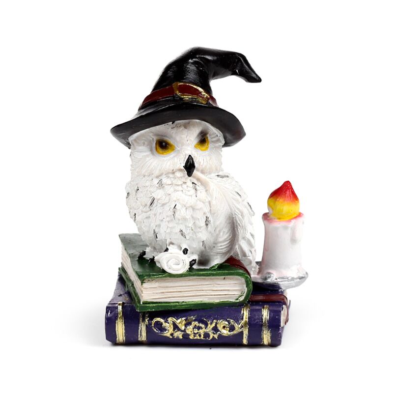 Wise old magical owl on spell book