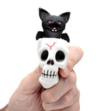 Skull bat pop out squeezable toy